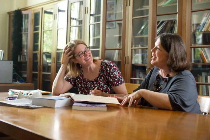 Two persons interacting in library